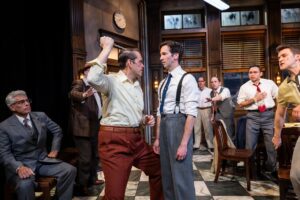 One juror intimidates another with a weapon in a production photo
