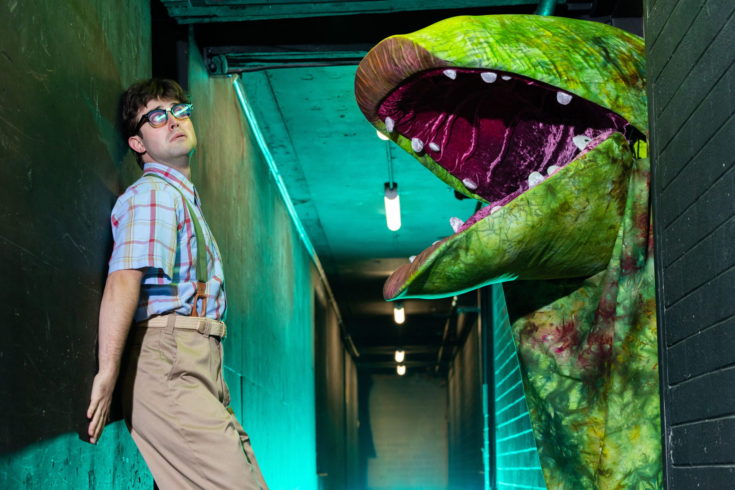 Andrew Faria and Joe Gallina as Audrey II in Pioneer Theatre Company's Little Shop of Horrors, Photo by BW Productions